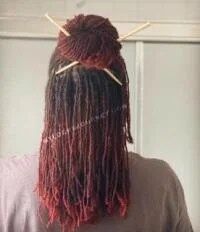 red sisterlocks bun with chopsticks